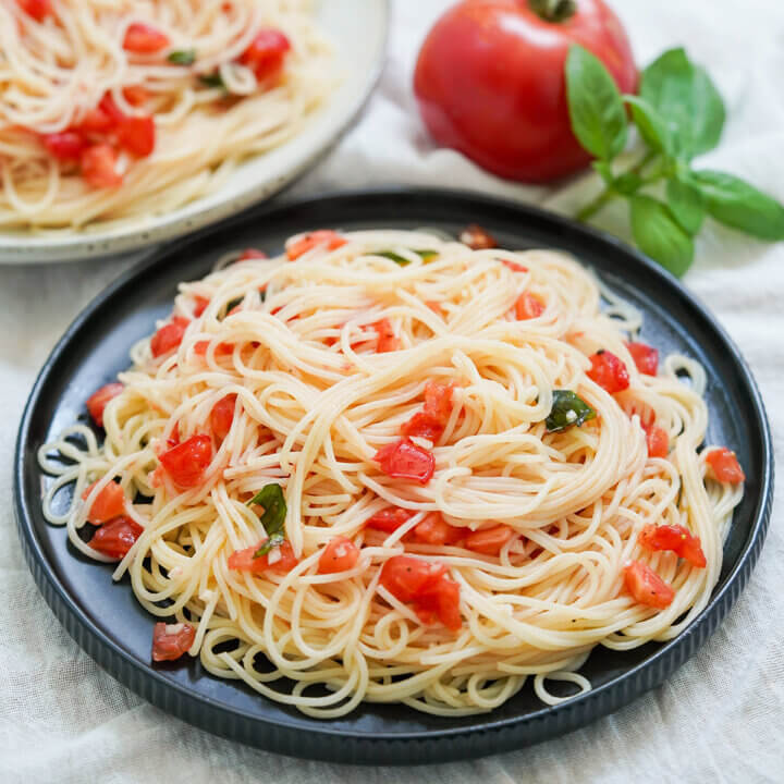 plate of pasta with fresh tomatoes, spaghetti al pomodoro crudo.