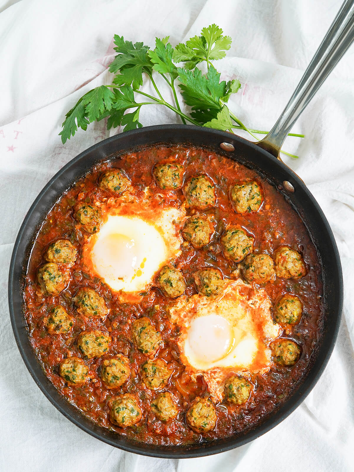 overhead view of skillet of Kefta tagine Moroccan meatballs.