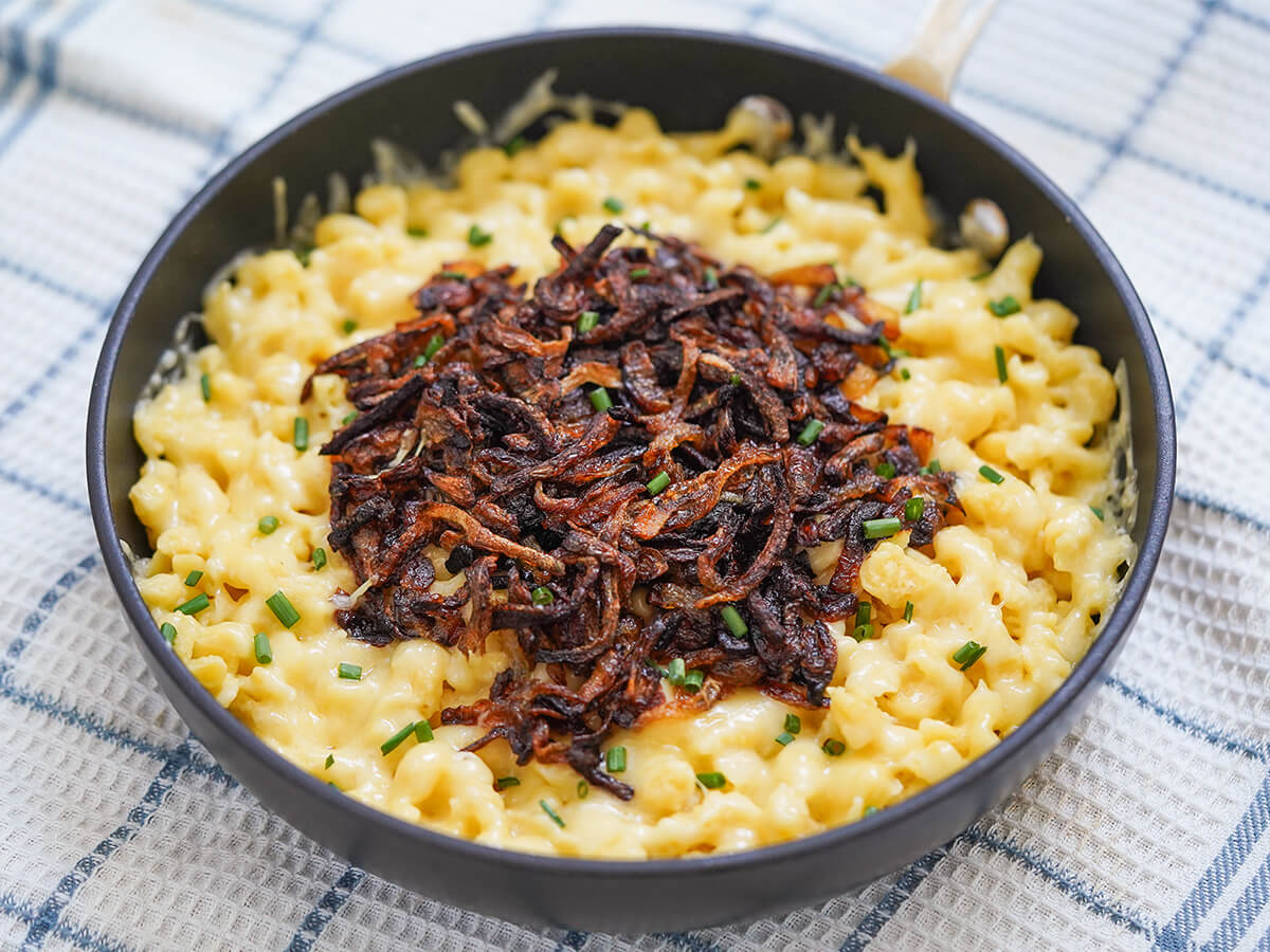 skillet of kaesespaetzle cheese spaetzle skillet of kaesespaetzle cheese spaetzle topped with caramelized onions.