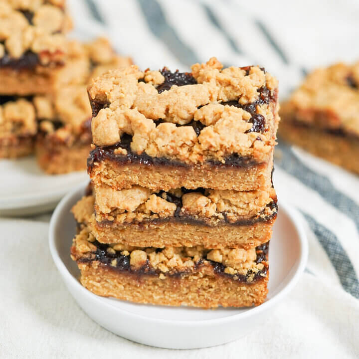 stack of three slices of peanut butter and jelly bars.
