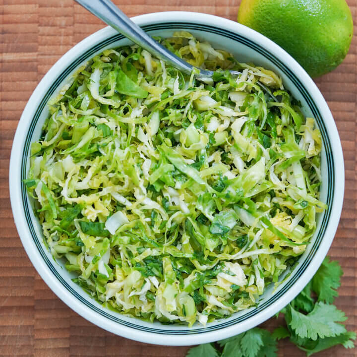 overhead close view of bowl of Brussels sprouts slaw.