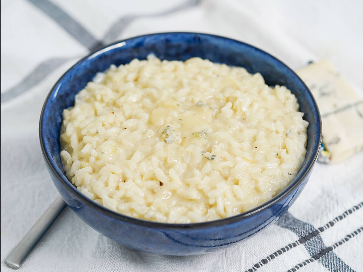bowl of gorgonzola risotto side view of bowl of gorgonzola risotto.